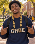 Man wearing the NC A&T GHOE block-letter hype chain on campus