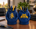Two navy North Carolina A&T hoodie pen holders on a professional business desk