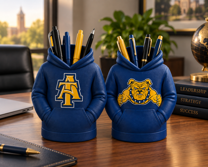 Two navy North Carolina A&T hoodie pen holders on a professional business desk